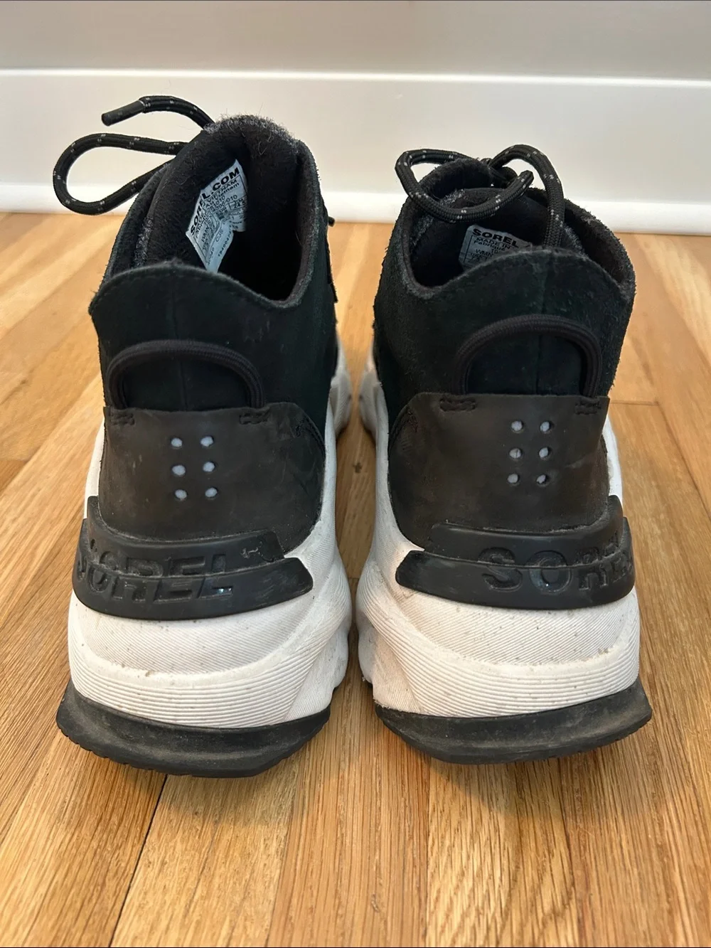 Sorel. Women’s Black Chunky Sneaker with White Sole.